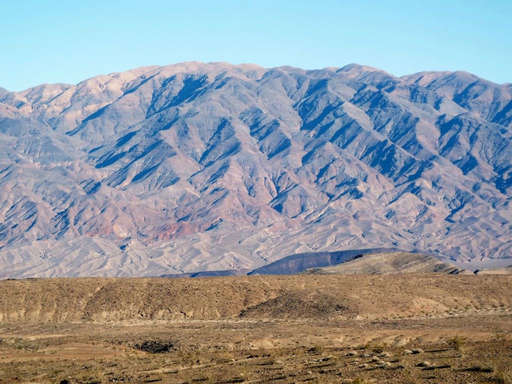 In looking across to the east at Tucki Mountain rising above Black Point, the actual Tucki summit is the bump about halfway between the middle and right side of the picture: