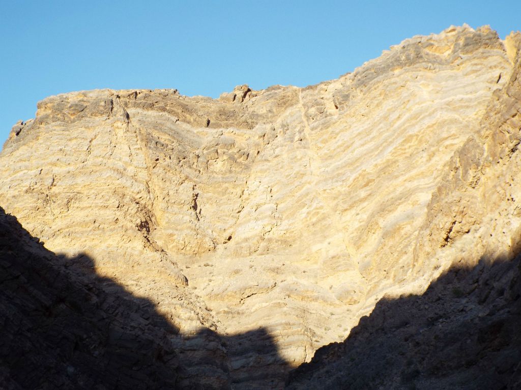 In the next two pictures, notice how the late afternoon sunshine really highlighted the pretty banded cliffs high above Pothole Canyon: