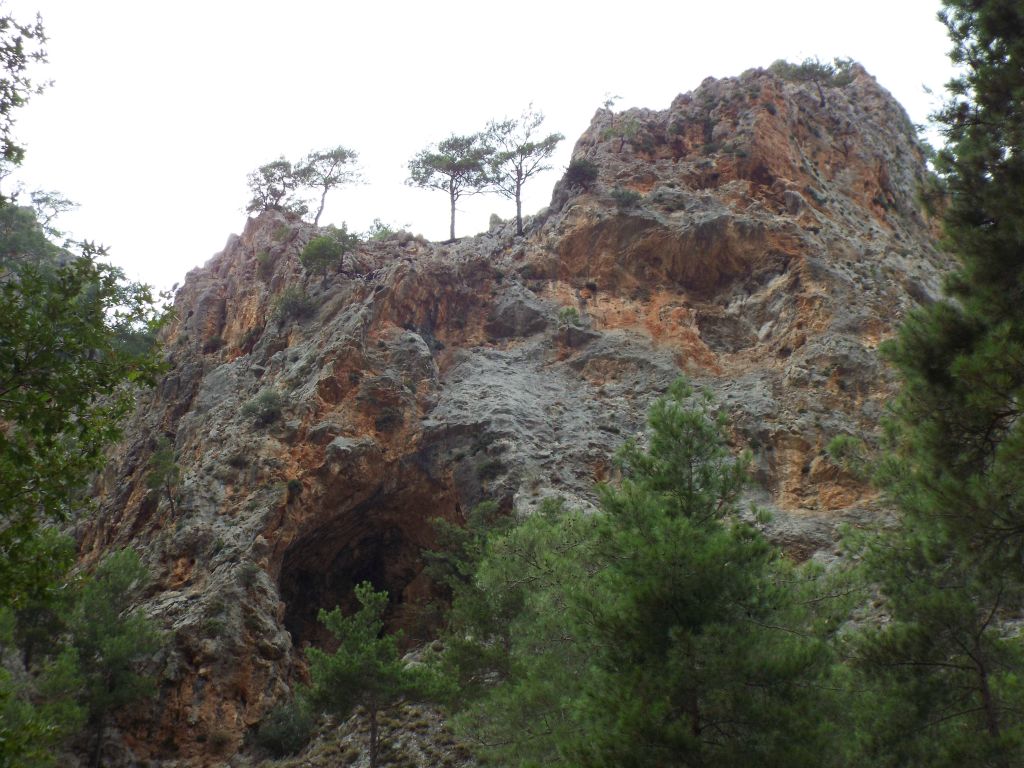 This canyon wall has formed several unusual shapes including a circular cave: