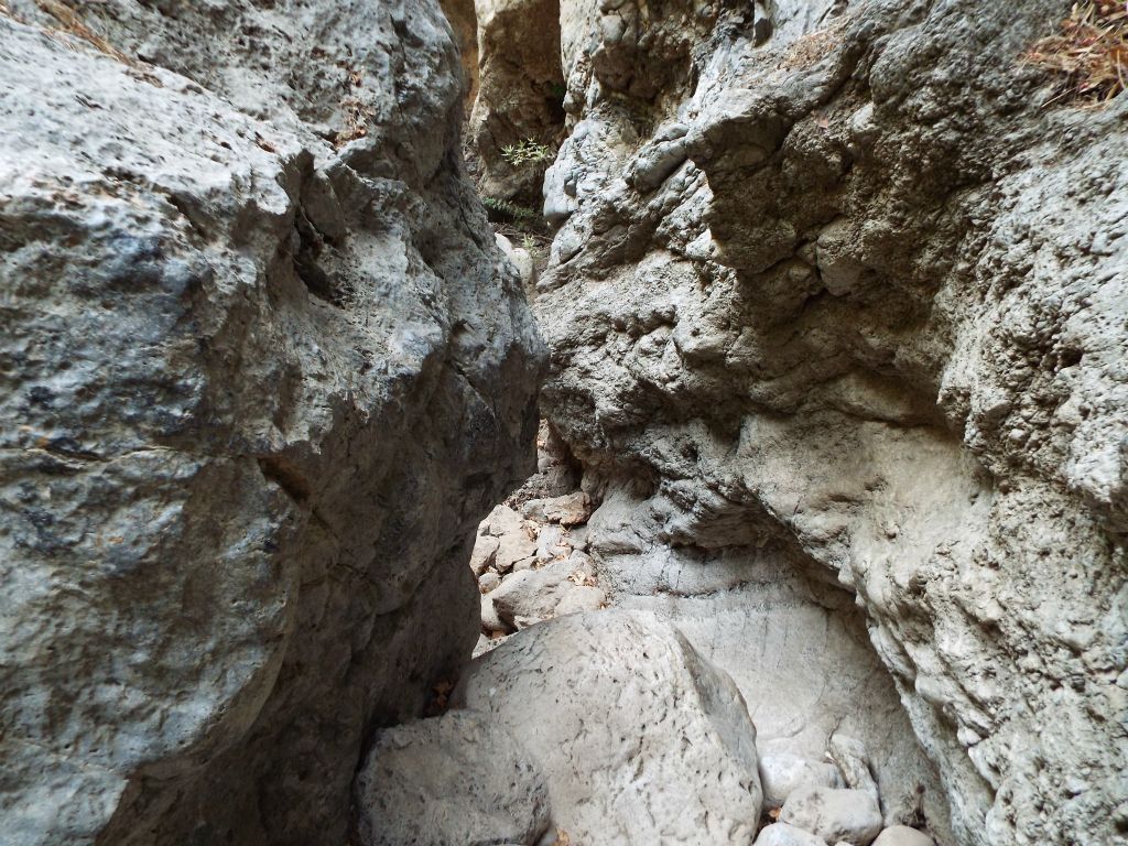 This is the narrowest spot in the entire gorge.  It has been created by a massive boulder which has forced water to flow through this small passage: