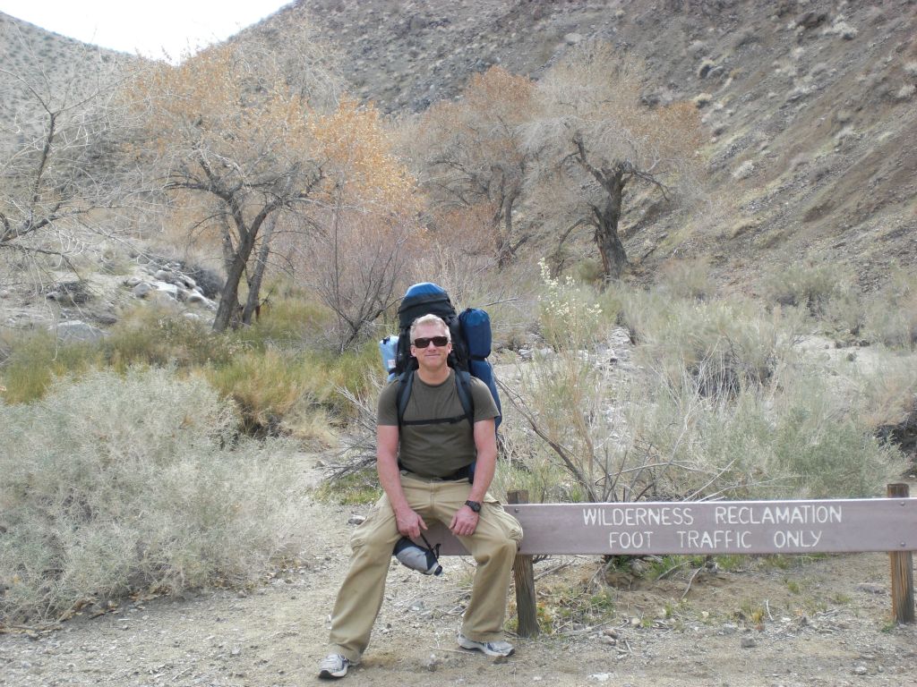 Conrad resting on the Wilderness Boundary sign at the end of Cottonwood Canyon Rd.  After going 8.4 miles, we were now at an elevation of 2,830 feet: