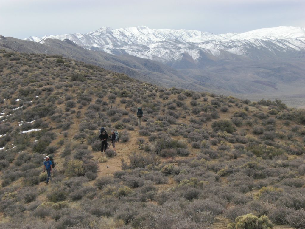 Looking down on our group as they are standing at the saddle which marks the first of the two passes: