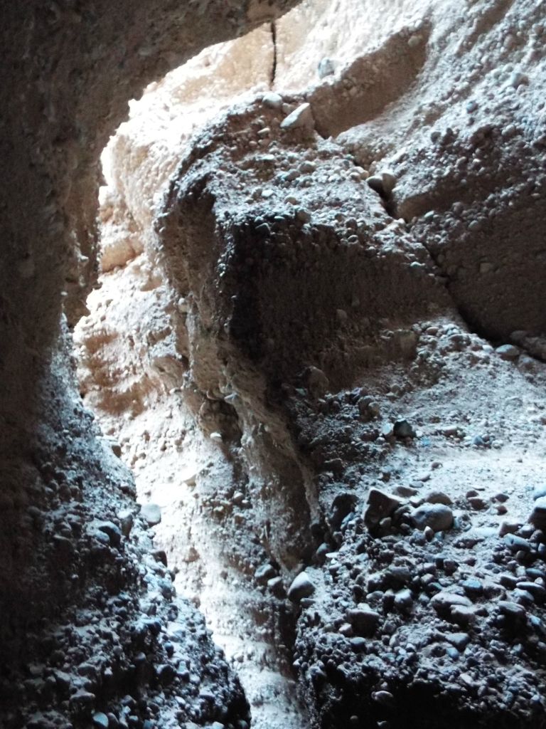 High up in the slot, the canyon wall curves into interesting designs: