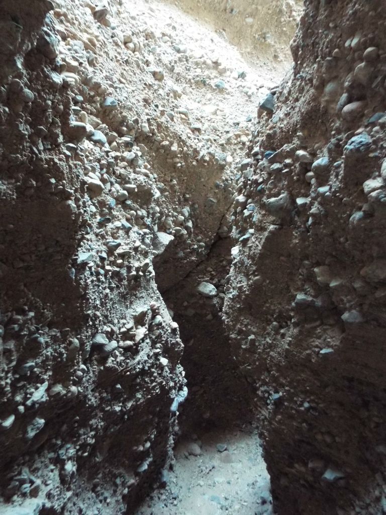 There is quite a bit loose conglomerate within the slot and if you are concerned about safety, you might want to wear a hard hat while walking through: