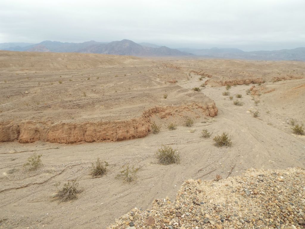 After some time, we ended up high above the neighboring main wash to the north: