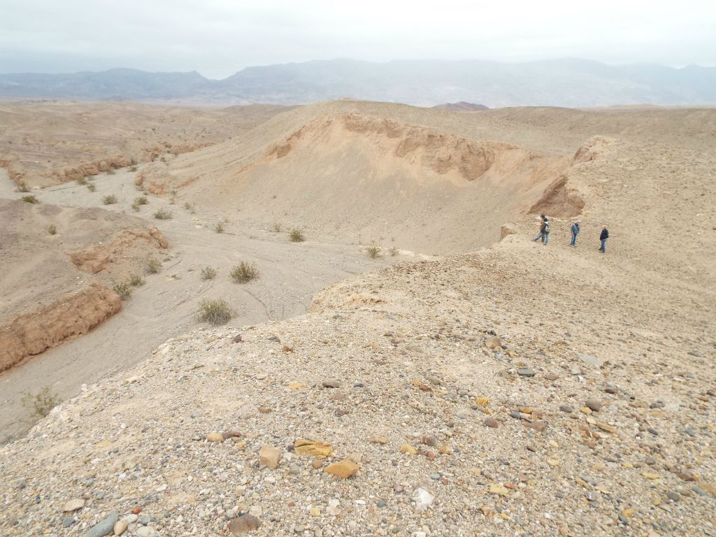 Our hiking group soon found a good route to get down.  We followed the ridge past where our group is seen standing on the cliffs until the darker rock disappeared and there was a more gentle slope down: