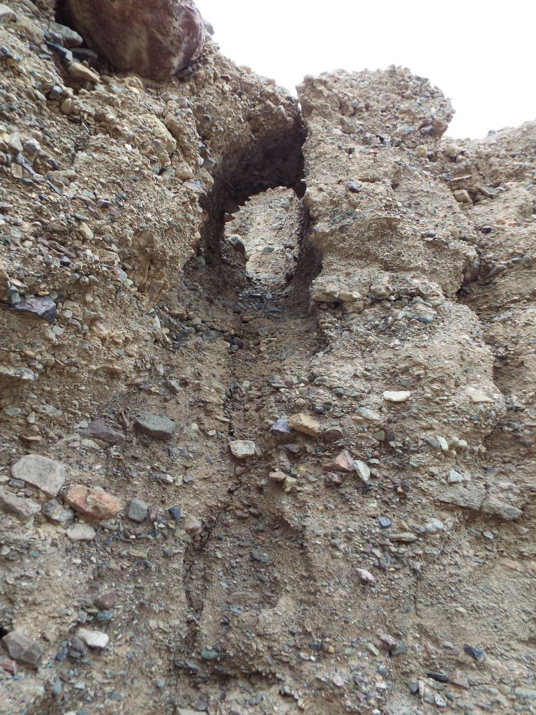 As part of our exploring, we checked a number of side canyons and a little drainage arch was found on one of the walls: