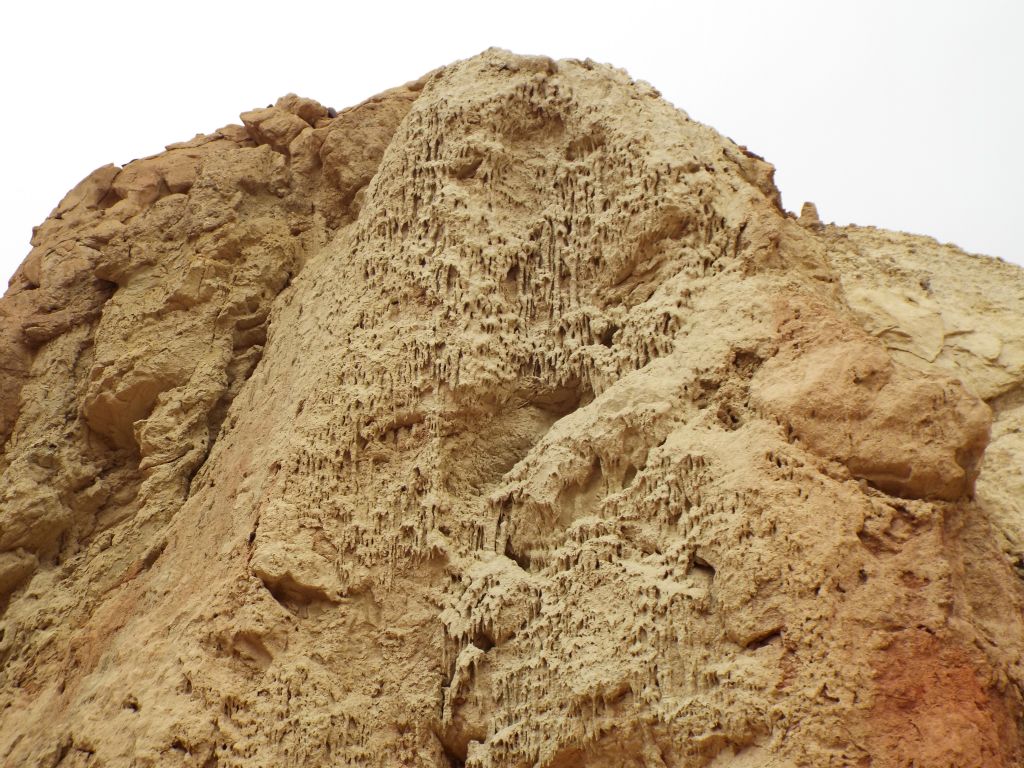 Two pictures showcasing impressive mud drip structures: