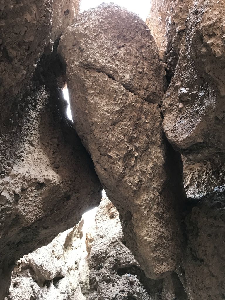 The giant boulder is top heavy and has a crack in the upper portion: