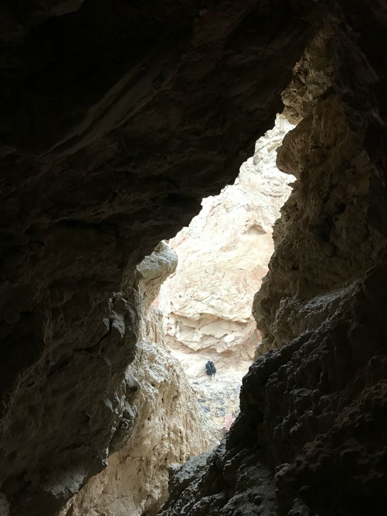 Two pictures taken as the view outside the natural tunnel comes into focus.  Note my backpack on the canyon floor below: