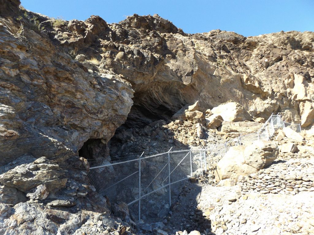 Upon reaching upper Keane Wonder Mine, you'll notice that access to these cliffs and caves is completely fenced off.  This area is really unstable due to all the mining activity which took place inside the mountain: