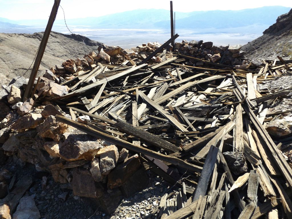 A collapsed wooden structure at Keane Wonder Mine that possibly served as housing for miners: