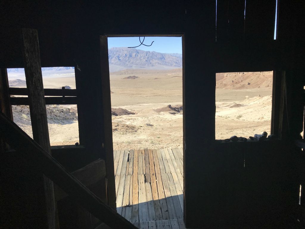View from inside the cabin looking out at many square miles of Death Valley desert: