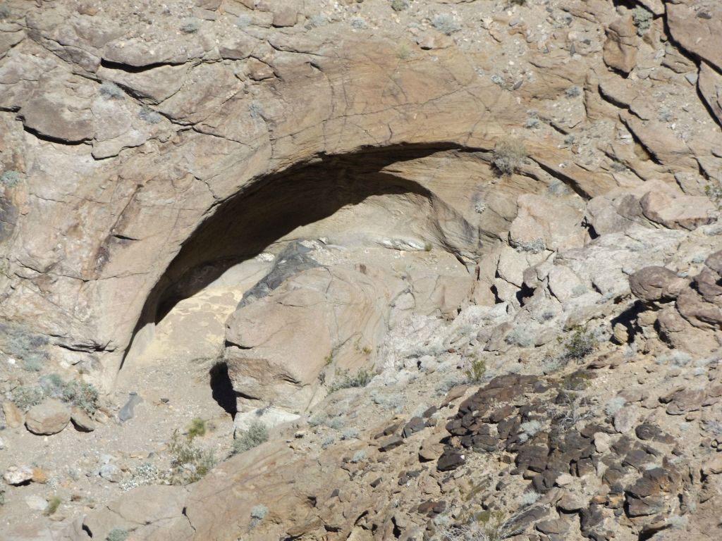 Zooming in on a unique curved rock wall down in the canyon below: