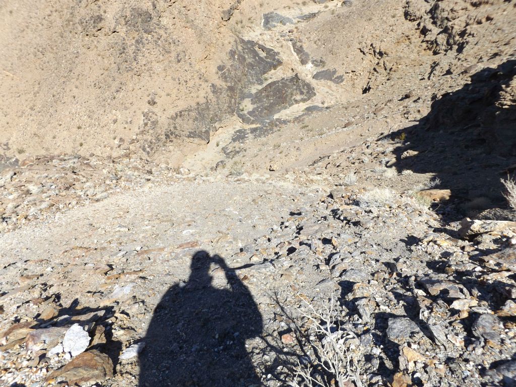 Another view looking straight down the steep slopes dropping into the canyon wash: