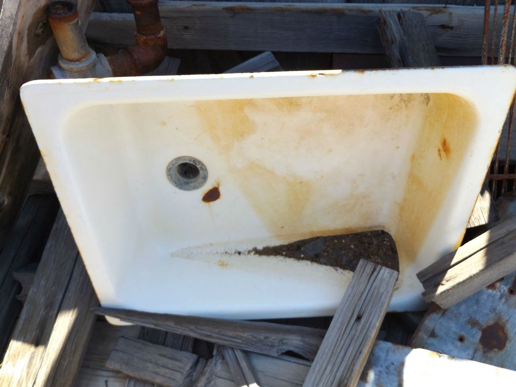 A full sink basin once was in use here for washing hands, dishes, and food: