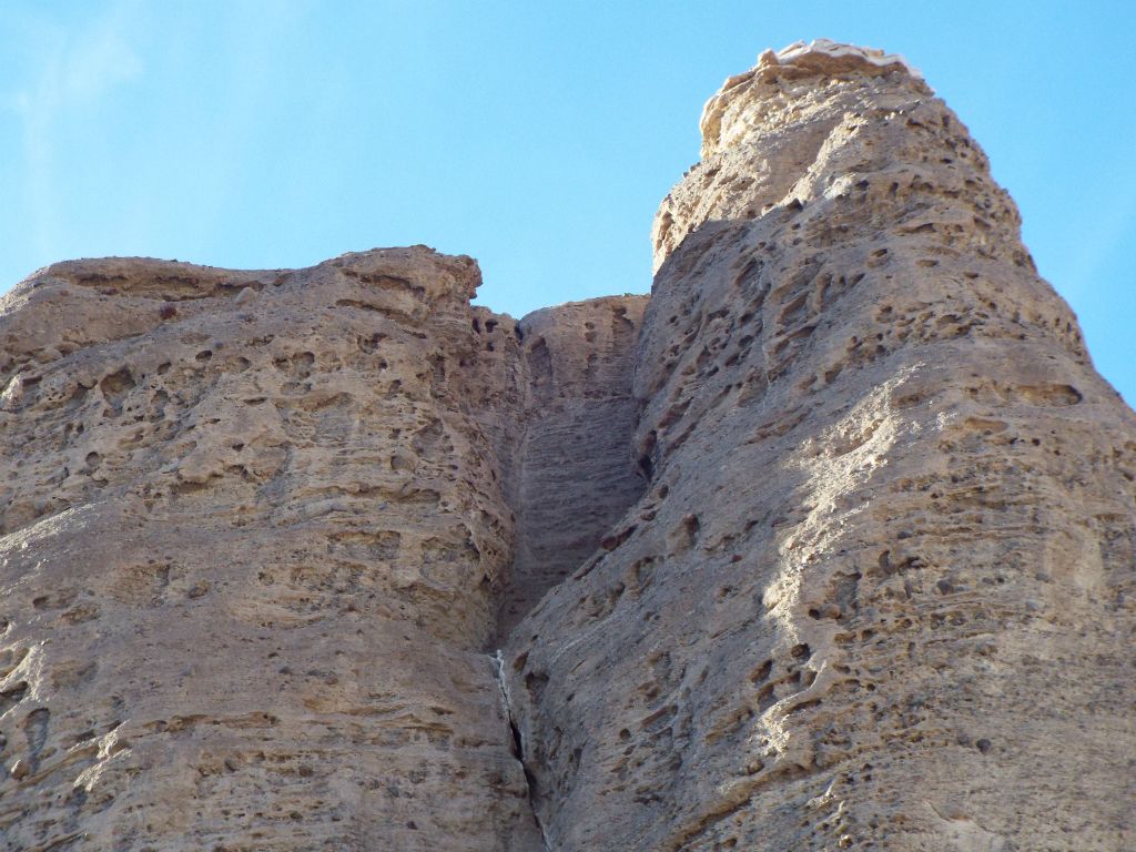 The canyon walls are covered with displays of honeycomb weathering or cavernous weathering up high: