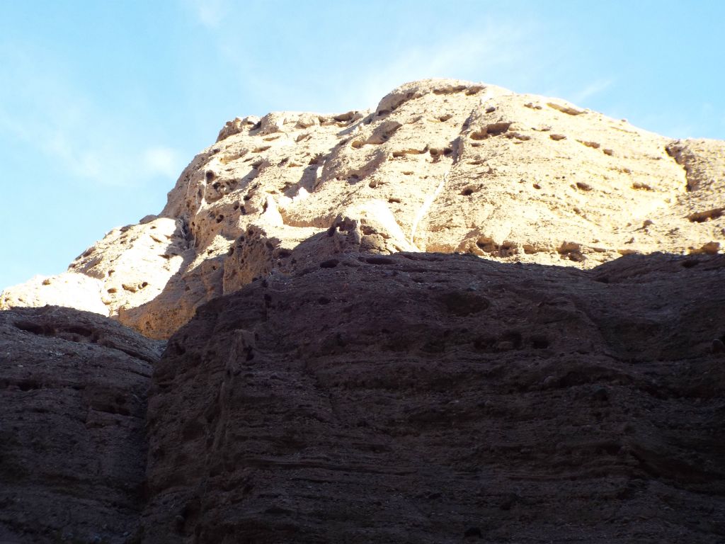 A small peak above the canyon bathed in sunlight:
