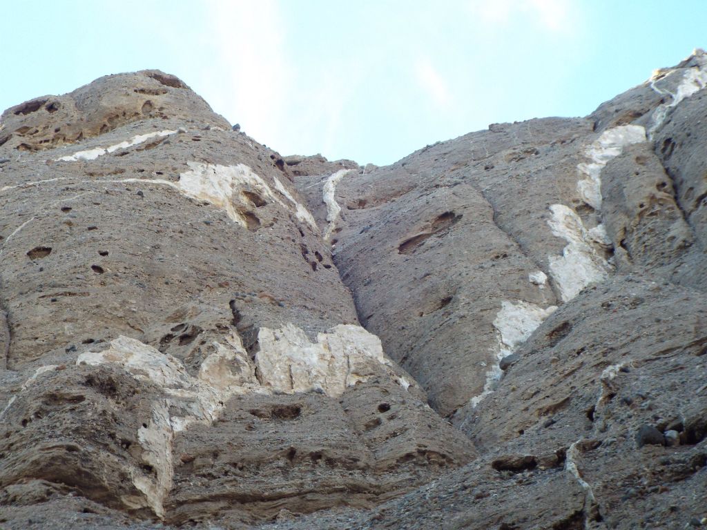 The white bands which were visible earlier now come into focus in the middle canyon: