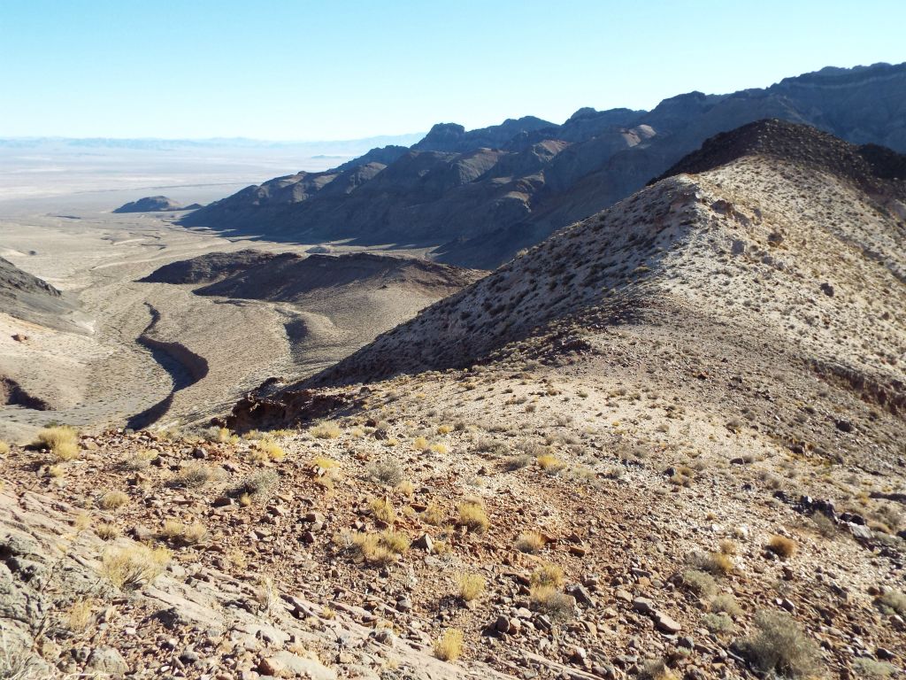 Briefly hiking uphill and then turning back to get a view of the 1st saddle.  It is not recommended to climb the ridge directly behind the 1st saddle.  Instead, it is suggested to use the frontside (on right) or backside (on left) routes: