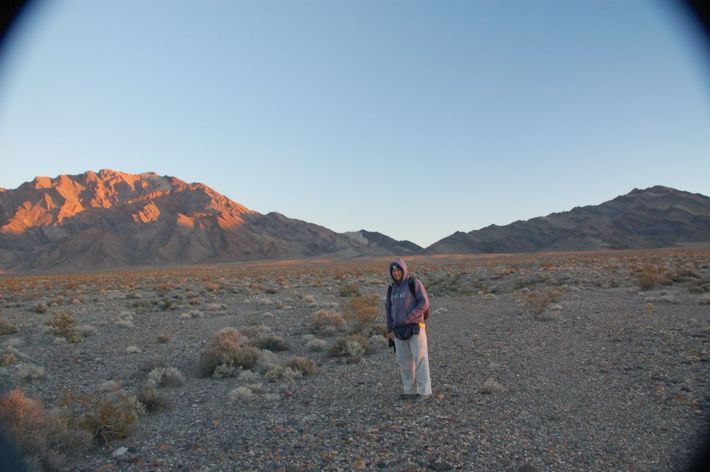 Staying warm as the sun finally shines upon the Pyramid Peak mountainside on the left: