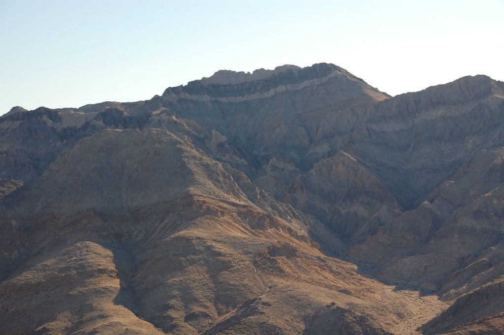 The colorful peak seen here sits on top of the range on the other side of the gap we hiked through earlier.  The Death Valley National Park boundary passes through the gap and this peak is located in the Funeral Mountains Wilderness Area: