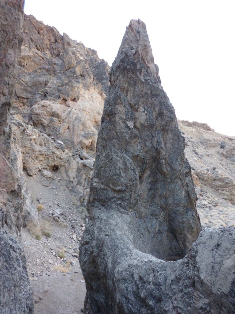 Looking back, there is a neat triangle-shaped rock pinnacle which guards entrance to this major rockfall:
