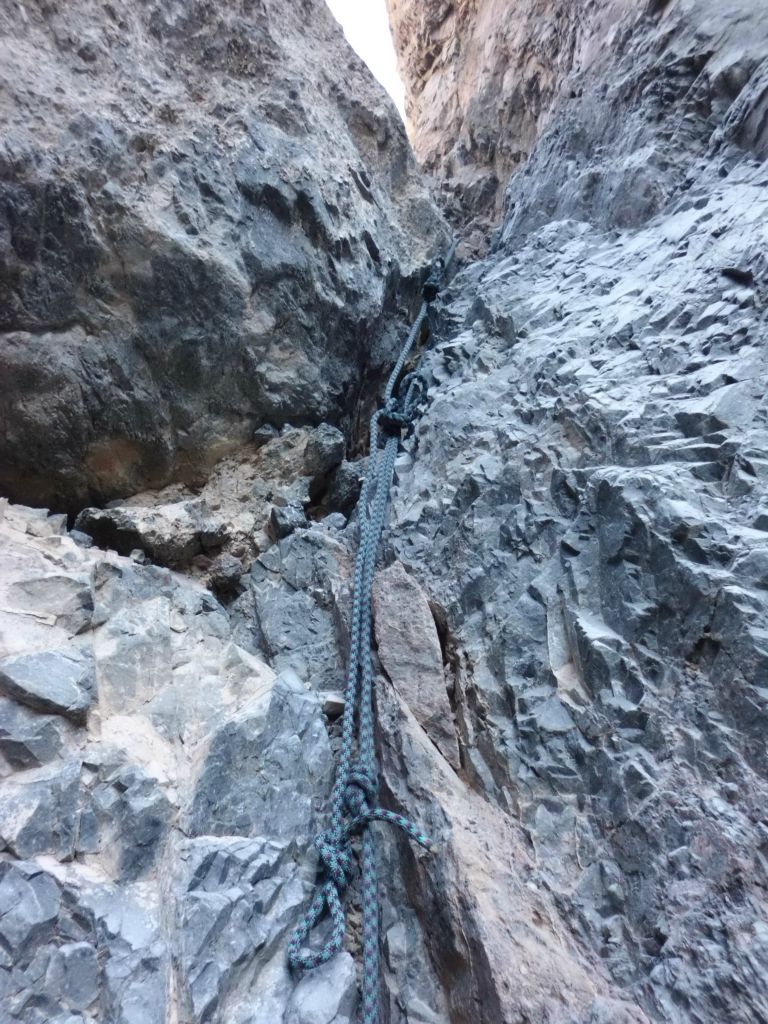 A while later, Patrick had amazed us with his great rock climbing skill and pro techniques and he lowered this rope with footholds for us to climb up: