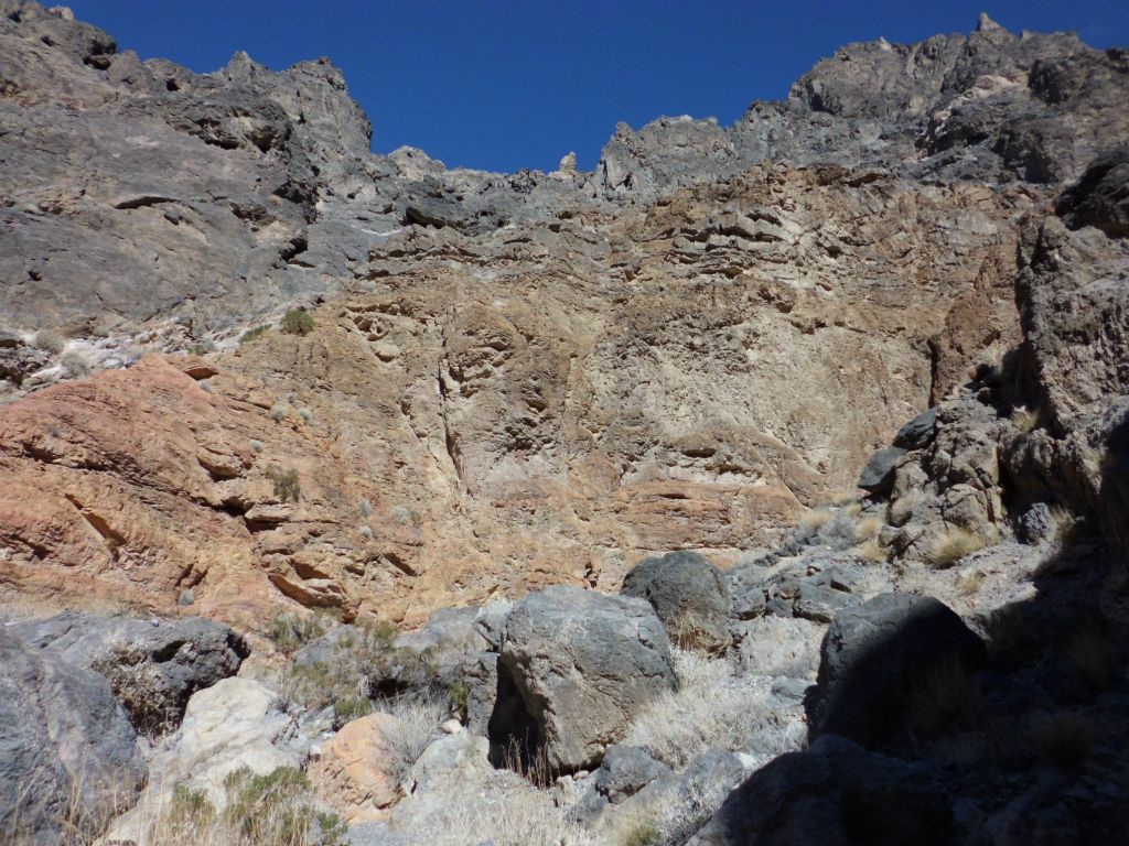 Red colors permeate the canyon wall in the distance: