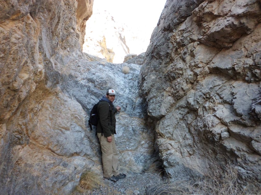A picture of Steve next to the 3rd major obstacle which was this dry fall: