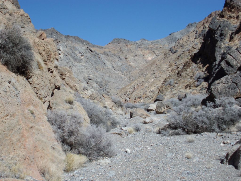 Emerging into an area of more dirt hillsides and less solid rock:
