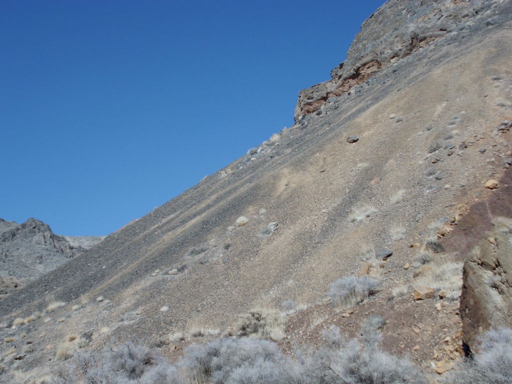 Check out this long diagonal rockslide of gravel down into the wash: