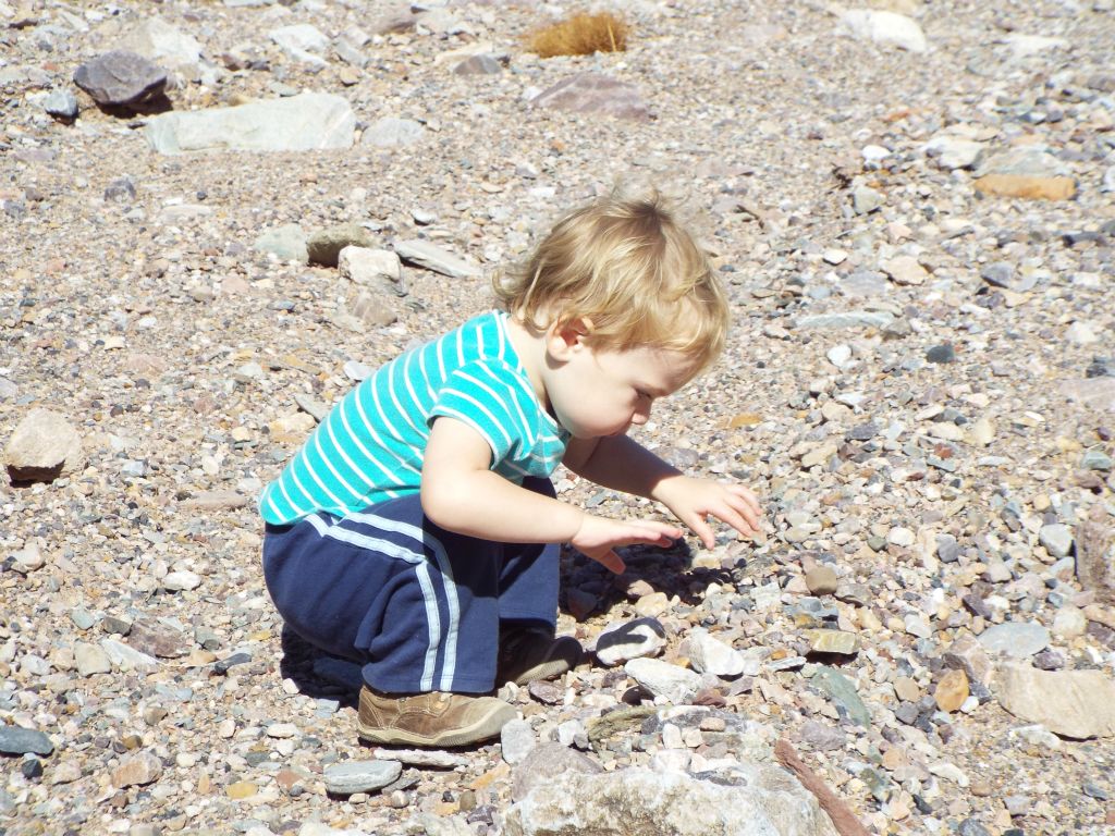 We took a break here so that Stefan could get out of his backpack carrier and play with rocks in the wash: