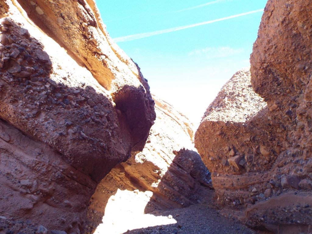 Notice the tilted angles of some of the rock layers in the canyon: