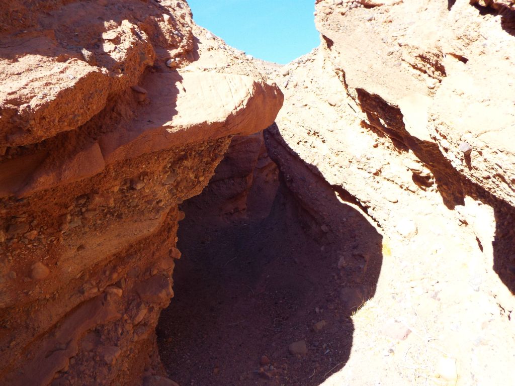 Ducking under an overhanging section of sandstone: