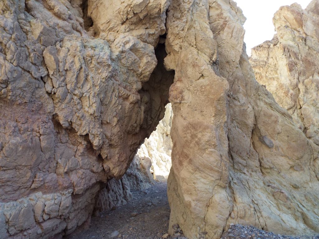 Badlands Bridge is labeled as a minor natural bridge.  However, it is possible that it is a false natural bridge.  It is really hard to say for sure: