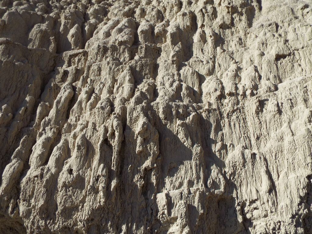 The terrain of the hillside was oddly textured all through the area: