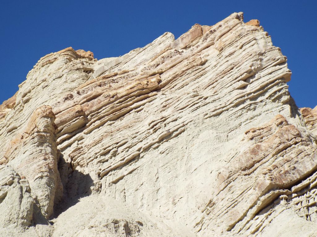 One of the mini-peaks above the fork has uplifted strata: