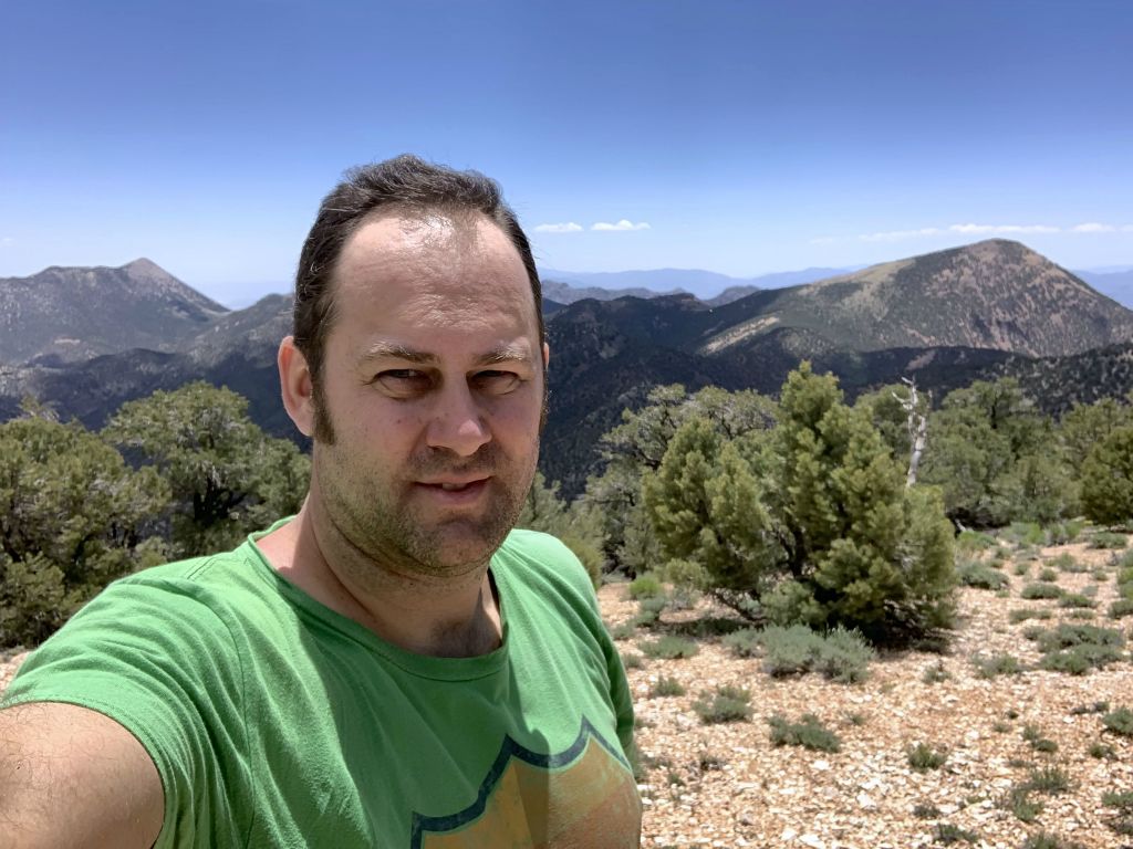 Arriving on the summit and getting a picture in between Wahguyhe Peak and Grapevine Peak: