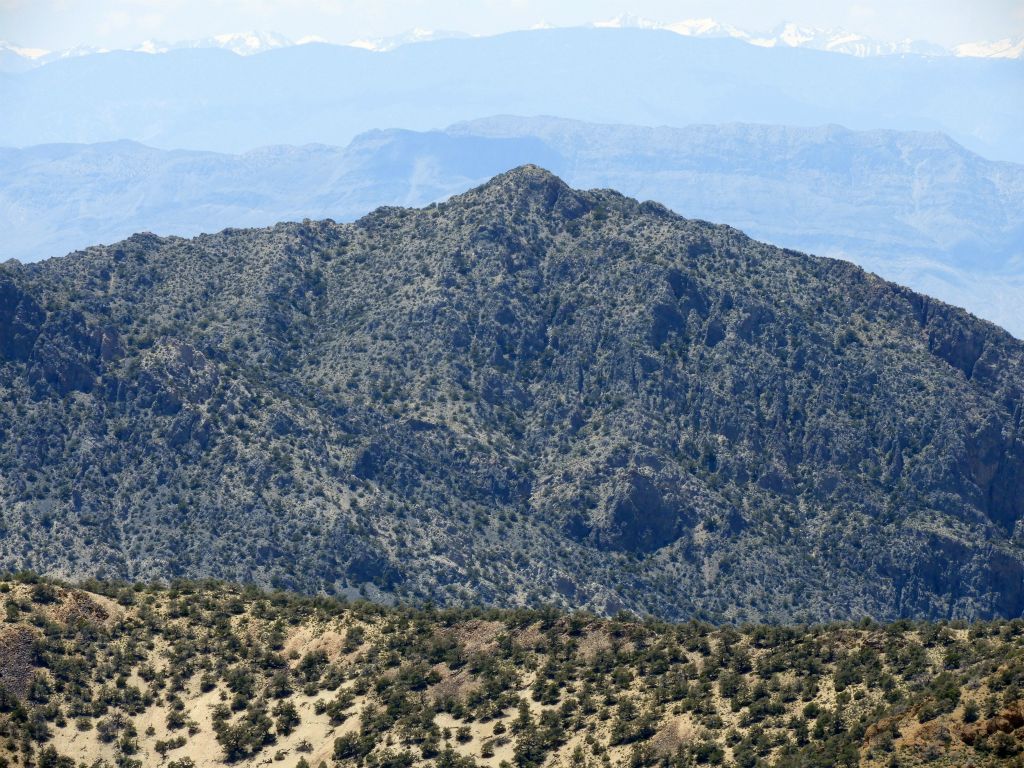 And the right peak is labeled as 8370T, being 90 feet lower in elevation: