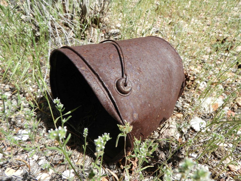 This old bucket has no doubt been sitting here in the canyon wash rusting away for many decades: