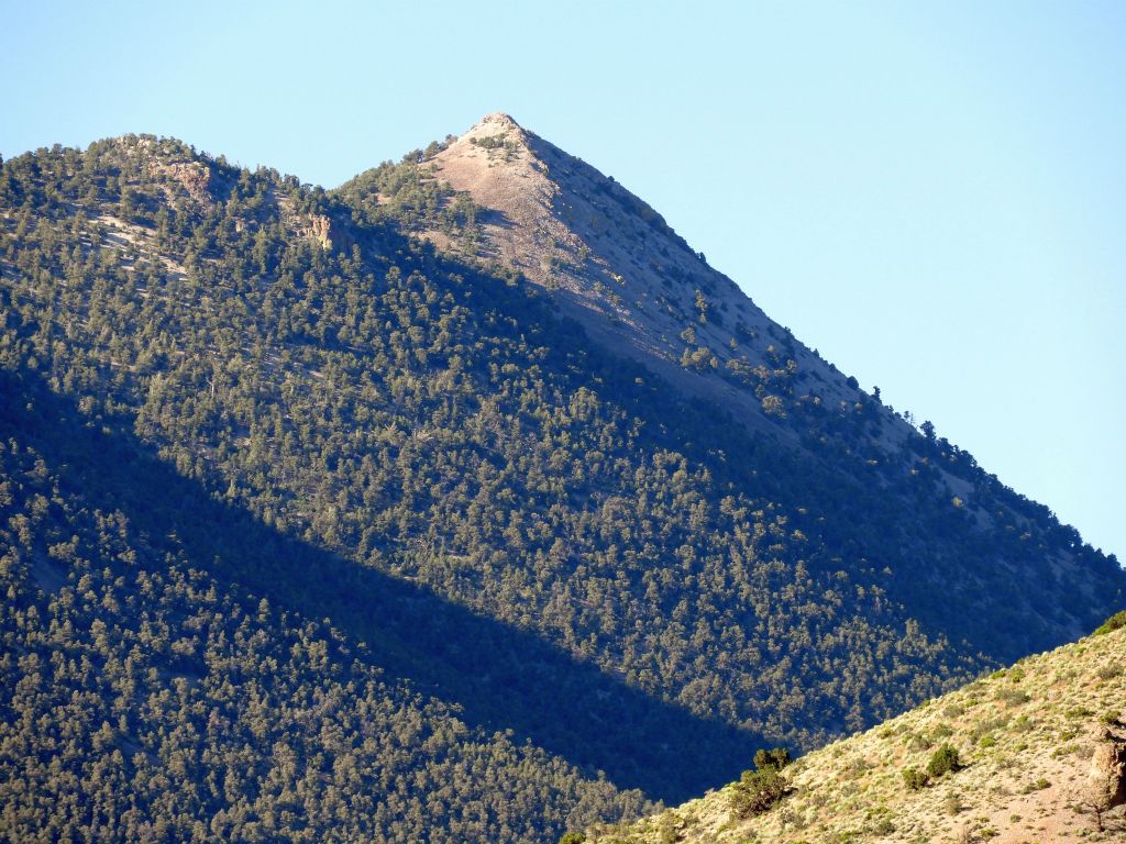 Zooming in on Wahguyhe Peak's famous cone-shaped summit.  One year earlier, I had climbed the merciless scree slopes seen here:
