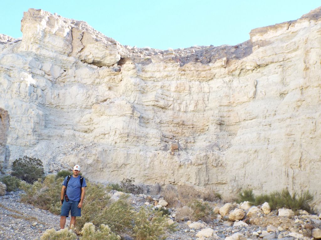 A picture of Steve in Crescent Bridge MSC in front of a section of vertical white cliffs: