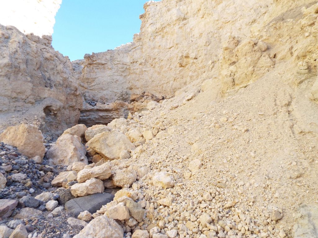 Approaching a massive rockslide area with small and large rocks: