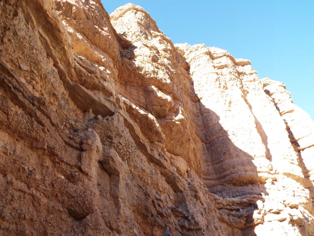 Tremendous height to the walls which seem to contain sentinels made of stone: