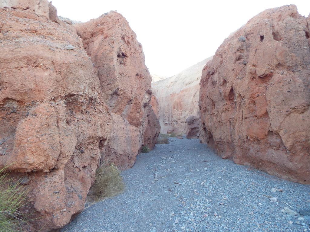 The red walls on both sides of the canyon come close together: