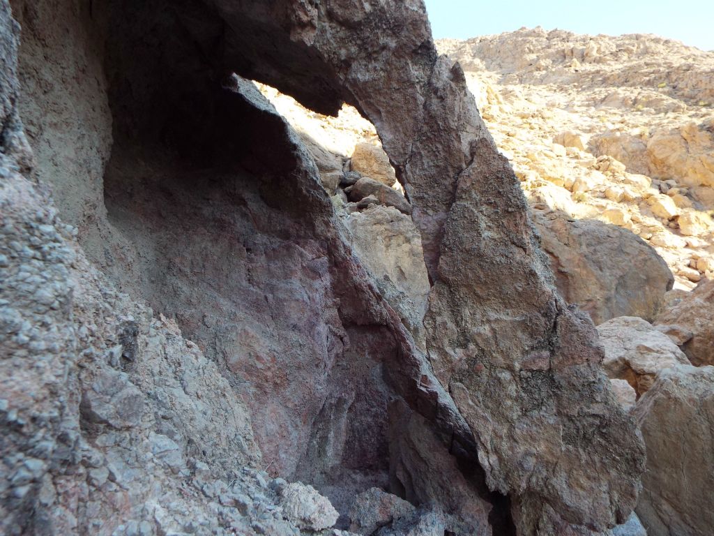 Passing by a neat little arch on the side of the canyon: