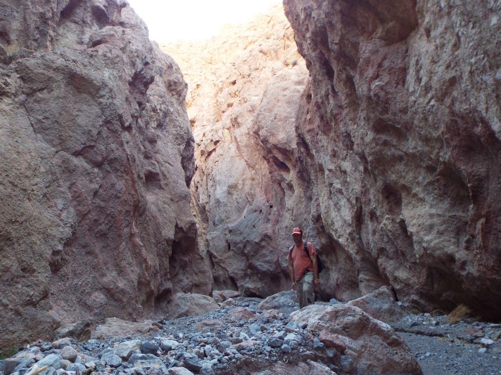 A picture of Steve deeper into the Lower Gallery narrows where the walls have become very high: