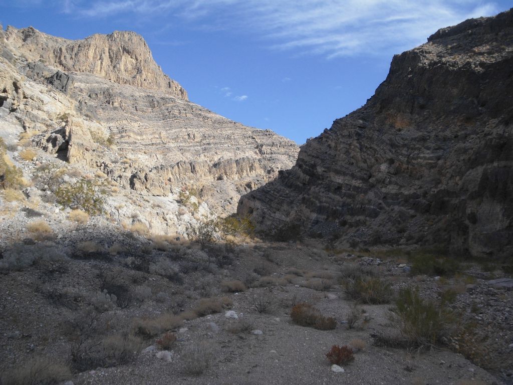 Looking ahead into the canyon, the walls grow even higher.  The high peak on the left is 1,100 feet above the canyon wash: