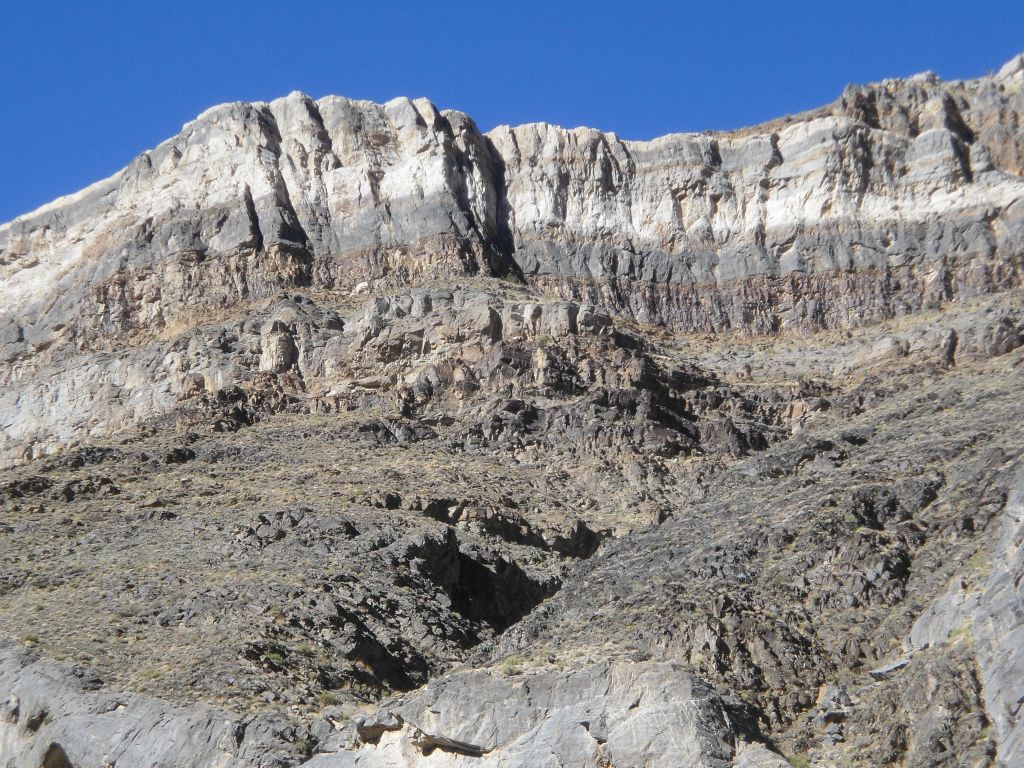 Admiring the different layers of rock way up on the mountainside: